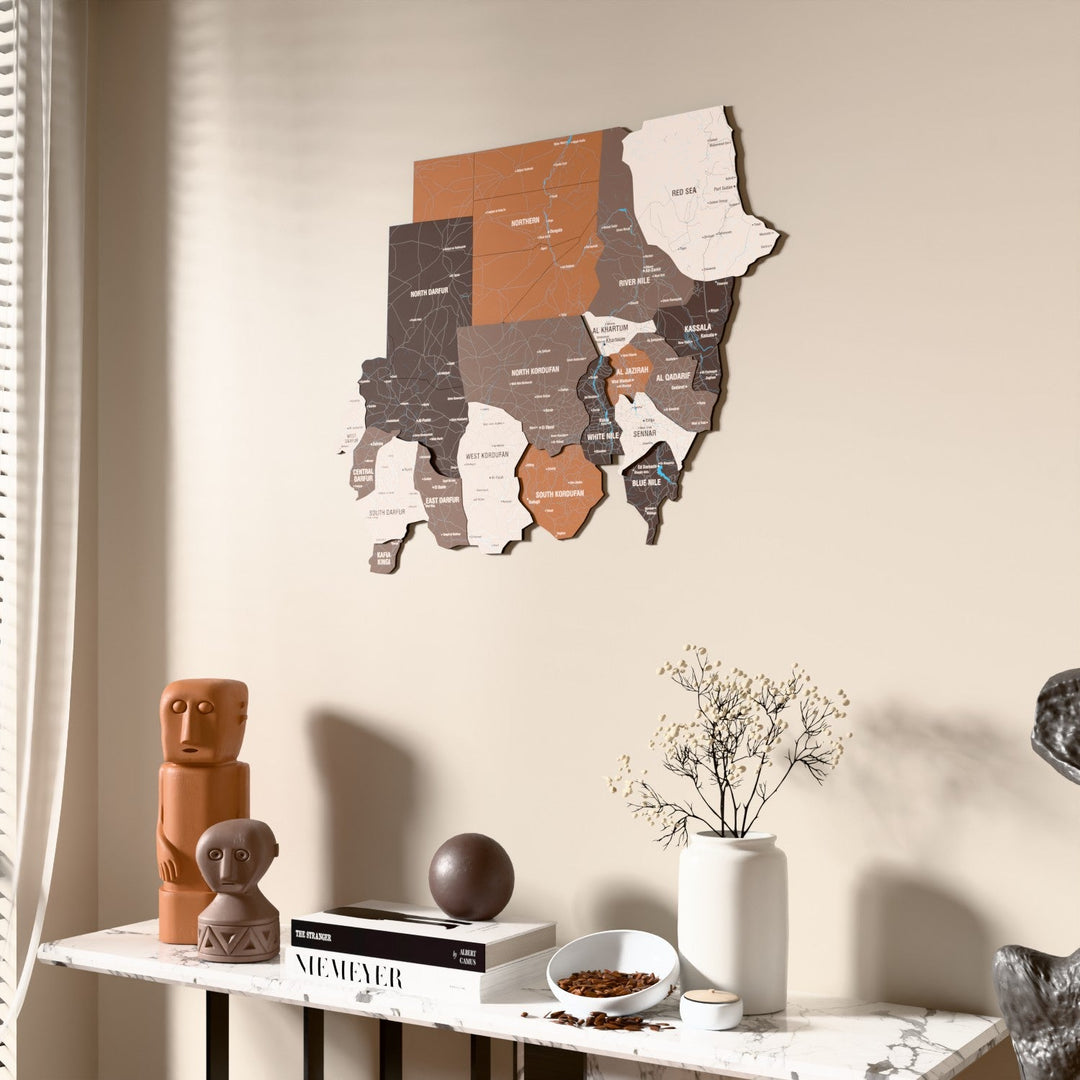 Soil Sudan wooden wall map beside a sheer curtain, angled view