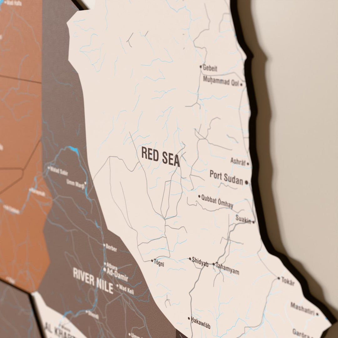 Close-up of the Soil Sudan wooden wall map with layered regions and printed names