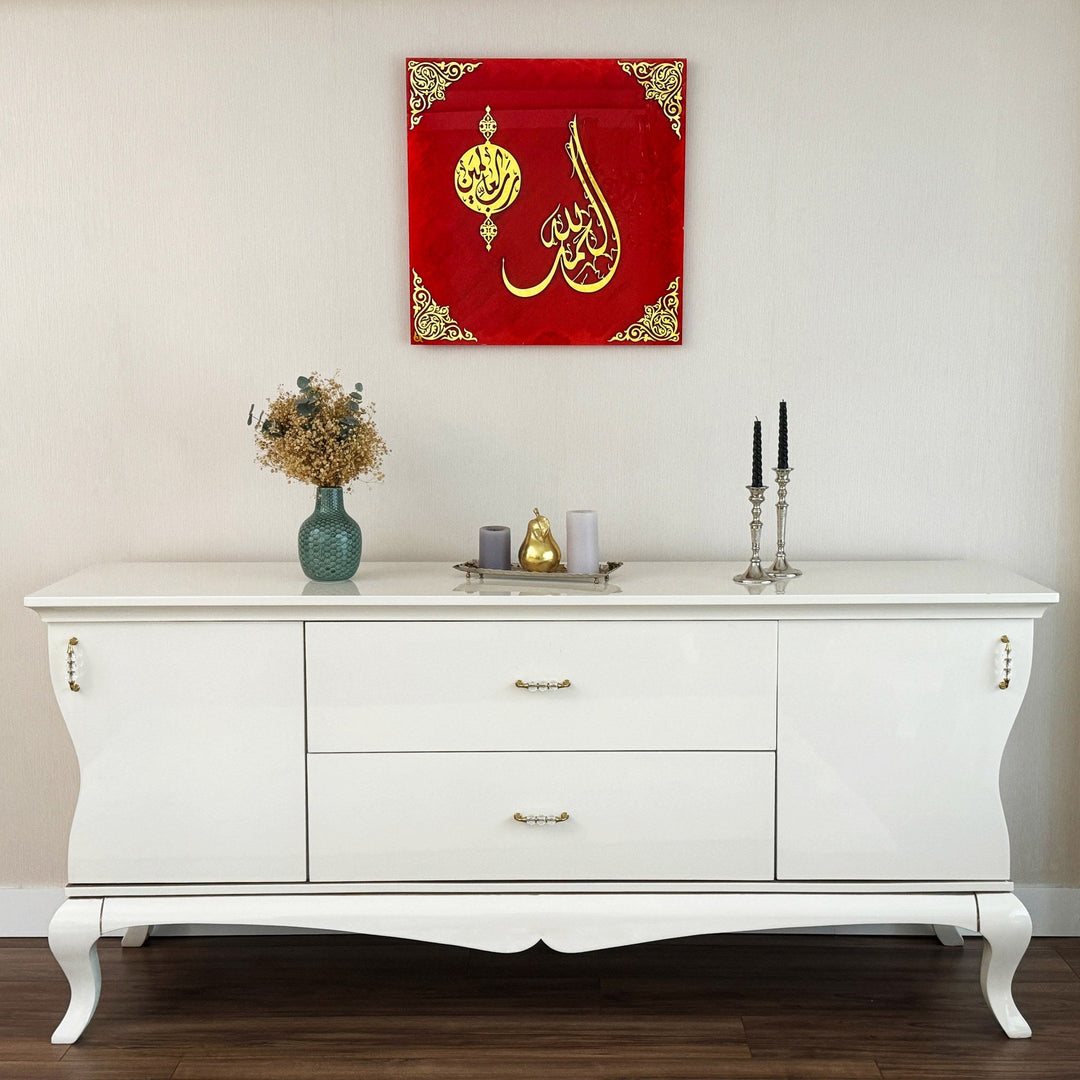 Surah Fatiha Ayat 1 red glass wall art hanging above a white sideboard, wide view
