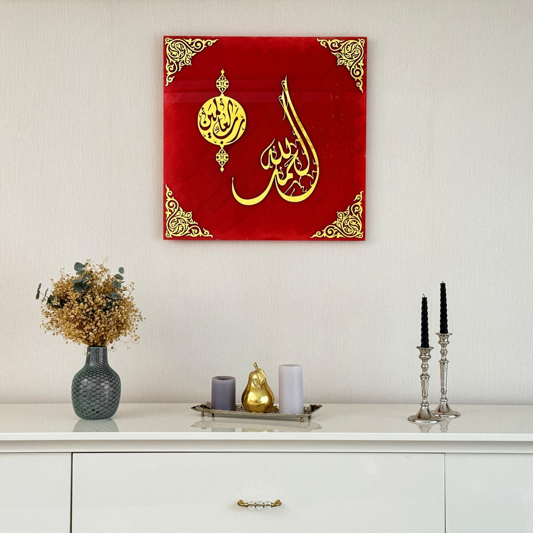 Surah Fatiha Ayat 1 red glass wall art above a white sideboard with candle holders