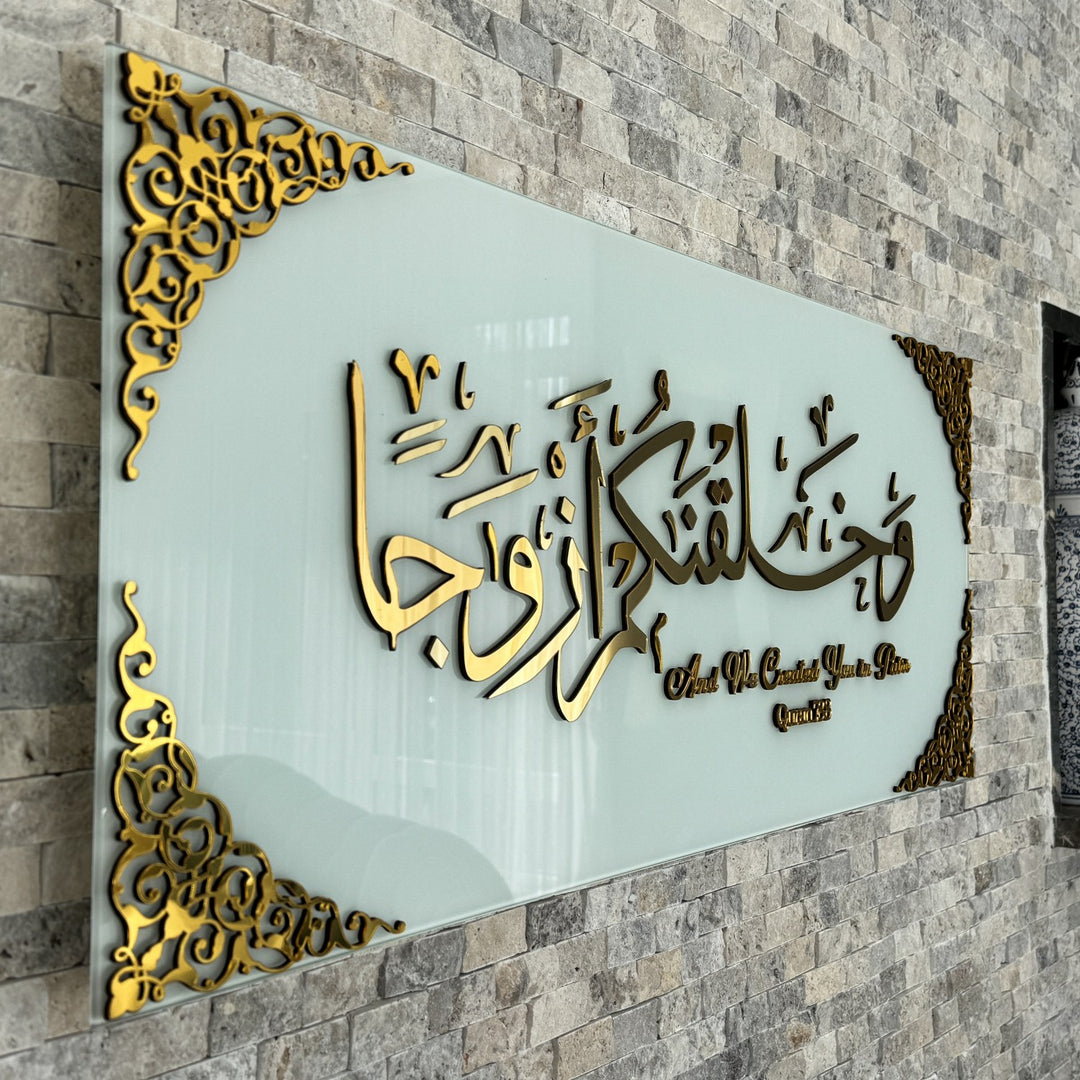 Close side angle of the Gold Acrylic calligraphy on Solid White glass