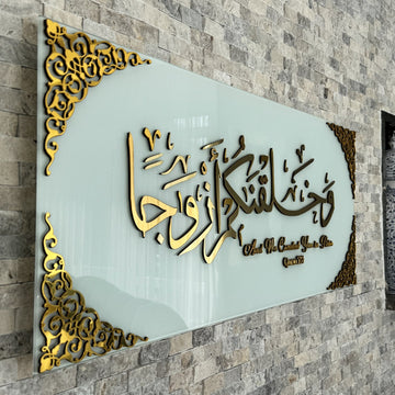 Close side angle of the Gold Acrylic calligraphy on Solid White glass