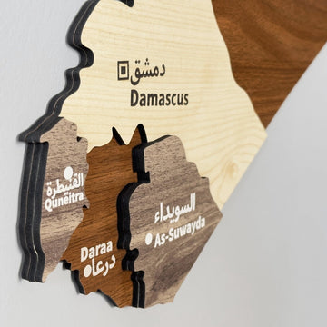 Close-up of the layered Damascus, Quneitra, Daraa and As-Suwayda regions on the Syria wooden wall map