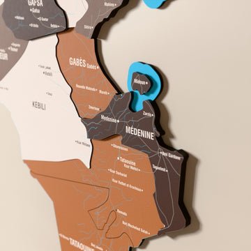 Close-up of the Soil Tunisia wooden wall map with layered regions and printed names