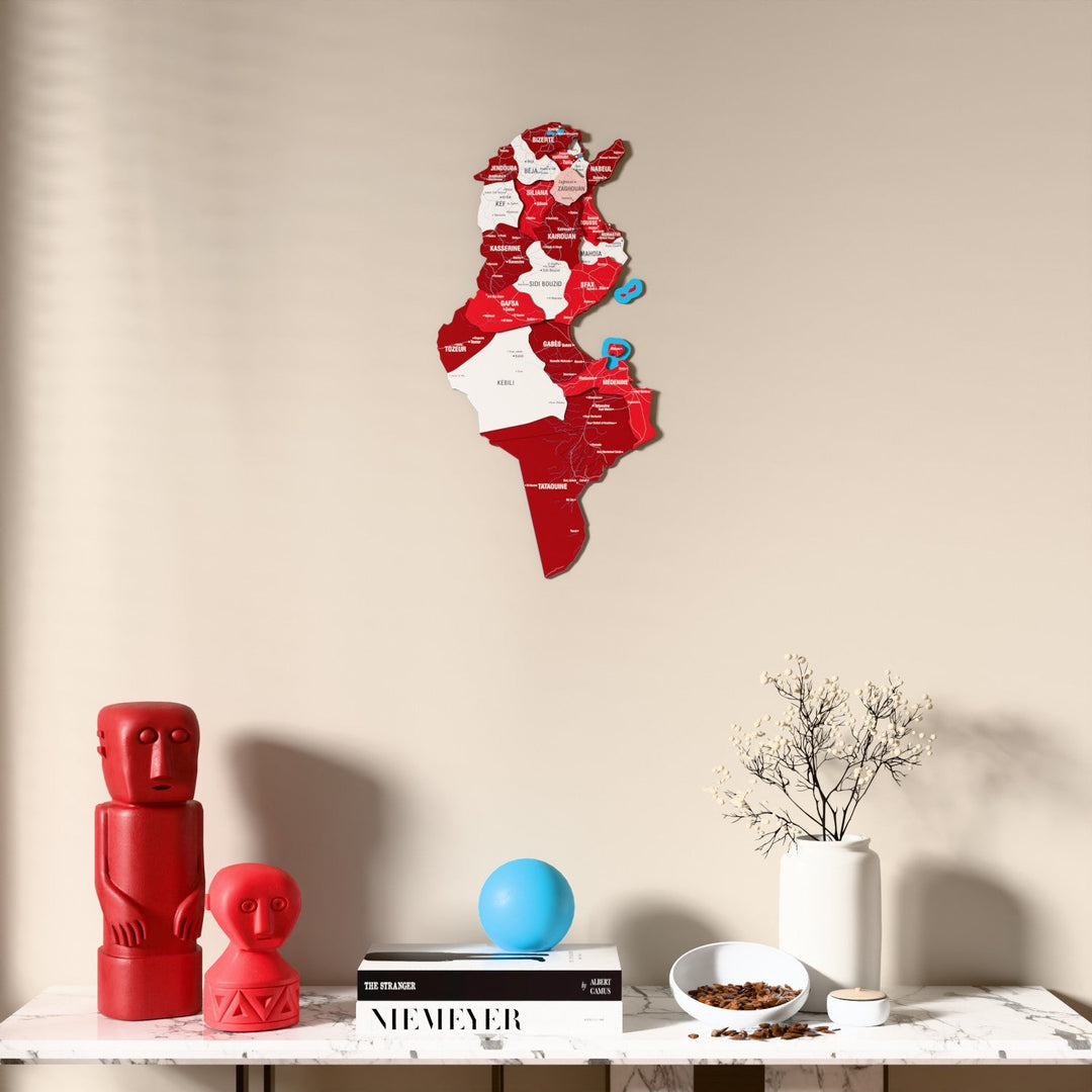 Flag colored Tunisia wooden wall map above a marble console, front view