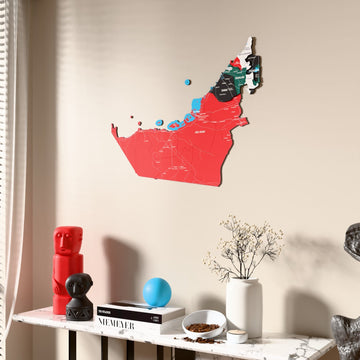 Flag colored United Arab Emirates wooden wall map beside a sheer curtain, angled view
