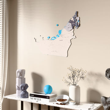 Nimbus United Arab Emirates wooden wall map beside a sheer curtain, angled view