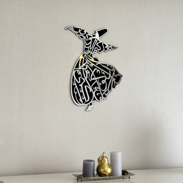 Whirling dervish wooden wall art with a silver acrylic face, front view on a plain wall