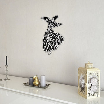 Silver whirling dervish wooden wall art seen from the side above a sideboard with a lantern