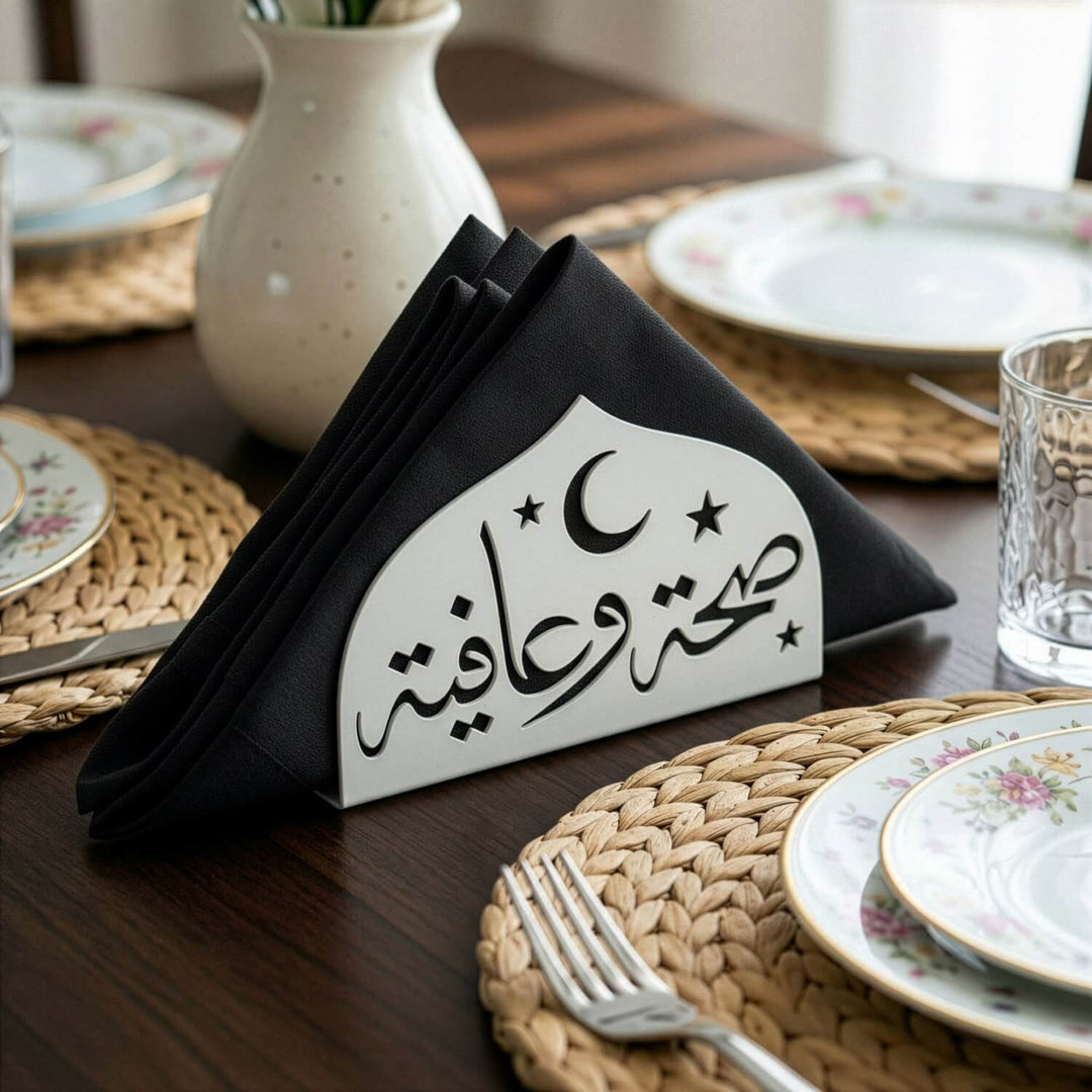 Saha w Afia metal napkin holder in white on a set table