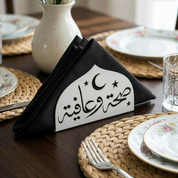 Saha w Afia metal napkin holder in white on a set table