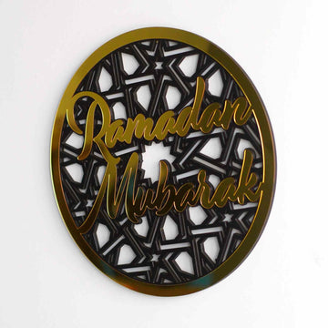 Gold Ramadan Mubarak circular wall decor with a geometric star pattern on a white wall