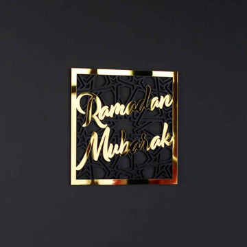 Gold Ramadan Mubarak square wall art with geometric pattern on a dark charcoal wall